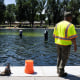 Image: National Park Service workers and contractors use vacuums to remove algae from the bottom of the Lincoln Memorial Reflecting Pool on June 20, 2026, in Washington, D.C. 
