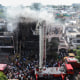Firefighters try to douse a fire that broke out at a coaching institute.
