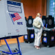 A voting booth as a voter scans their ballot in New York.