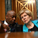Senators Tim Scott (R) and Elizabeth Warren (D) speak during a confirmation hearing in Washington.