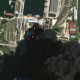 A satellite image shows fire and smoke rising from oil tanks, after what Ukrainian President Volodymyr Zelenskiy said was an attack on an oil depot in the city of Kerch