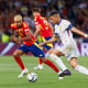 Kylian Mbappé of France is challenged by Lamine Yamal of Spain