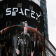 Elon Musk on screen in Times Square.