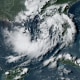 A color satellite image of a tropical depression in the ocean.
