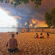 Smoke from wildfires fills the sky over a beach in Lacanau, southwestern France, on July 24, 2026.