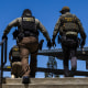 The Ventura County Government Center has been the site of tense standoffs and confrontations in recent weeks between US Immigration and Customs Enforcement (ICE) agents, local community observers, and protesters. (Photo by Blake Fagan / AFP via Getty Images)