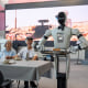 A humanoid robot serve a dish at the AI restaurant of the Global Pioneer AI Hub on Thursday, July 23, 2026 in Shenzhen, China.