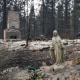 A statue of the Virgin Mary in front of a burned home in the Balboa neighborhood of Spokane, Wash., on Aug. 2, 2026.