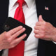 President Trump puts his phone in his pocket during a roundtable at the White House June 18, 2020.