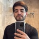 Cesar Gastelum takes a selfie in a bathroom mirror