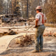 A worker pauses to look at the debris.