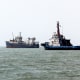 Three ships in a row on the water