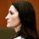 Side profile of Lindsay Clancy sitting inside of a court room