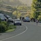 Traffic stopped along Highway 19 in Carter County, Tenn. at the scene where two Tennessee college team cyclists were killed by a motorist while training on Aug. 19, 2026.