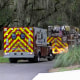 Two Midway ambulances are seen parked in the street.