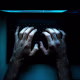 Hands on a laptop.