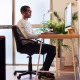 Young creative man working at computer in his home office
