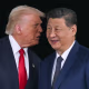 President Donald Trump talks to China's President Xi Jinping after their talks at the Gimhae Air Base in Busan, South Korea, on October 30, 2025.