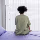 Lonely patient sitting on the hospital bed