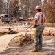 A worker pauses to look at the debris.