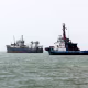 Three ships in a row on the water