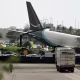 Amazon Cargo Plane tilted on its side off an airport tarmac