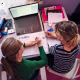 Image: Mother is helping daughter with homework in her room.