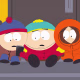 South Park characters, from left, Stan Marsh, Eric Cartman, Kenny McCormick, sitting on a set of stairs in front of a door looking at a phone together