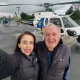 Image: Eliana Moreno and George Marciniw pose for a selfie in front of an NBCLA branded helicopter.