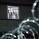 Detainees stand by a window at Delaney Hall, an ICE facility in Newark, N.J., on May 26, 2026.