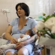 Liudmyla Moriak with her newborn son Oles. Moriak lost her husband Serhii in the war fighting against Russia. 