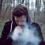 Man Smoking In Forest