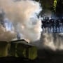 Image: Police officers in riot gear fire tear gas in front of the Brooklyn Center Police Station as people gather to protest after a police officer shot and killed a black man in Brooklyn Center, Minneapolis,
