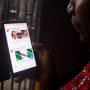 Image: A woman tries to tweet on a smartphone in Lagos on Oct. 29, 2018.