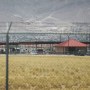 Fort Bliss, which holds temporary housing for migrants is seen through a fence on June 25, 2018 in Fort Bliss, Texas.