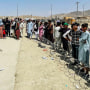 Image: Hundreds of people gather outside the international airport in Kabul, Afghanistan on Aug. 17, 2021.