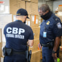 CBP officers in Atlanta inspect apparel suspected to be made with cotton harvested by forced labor in China's Xinjiang Region, August 2021.