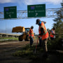 Image: Highway workers clear debris after Hurricane Ida in Destrehan, La., on Aug. 31, 2021.