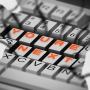Illustration of hands about to type on a keyboard that spells out "You're Next"