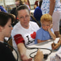 Image: Ruby Partin, 63, and her adoptive son Timothy Huff, 5, visit the free annual Remote Area Medical health clinic on July 22, 2017 in Wise, Va.