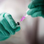 A health care worker prepares a dose of the Pfizer-BioNTech Covid-19 vaccine in Berlin on Nov. 23, 2021.