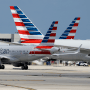 An American Airlines jet taxis to the gate at Miami International Airport.