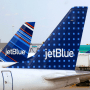Image: FILE PHOTO: JetBlue Airways aircraft are pictured at departure gates at John F. Kennedy International Airport in New York