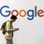 A man walks past Google during the VivaTech trade fair on May 24, 2018 in Paris.