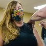 Kristi Scott receives a flu vaccine at Great Falls College in Great, Falls, Mont., on Nov. 16, 2021.