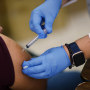 A health worker administers a Moderna Covid-19 vaccination in Immokalee, Fla., on May 20, 2021.