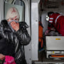 A woman reacts as paramedics perform CPR on a girl who was injured during shelling, at city hospital of Mariupol, eastern Ukraine, Sunday. The girl did not survive.