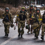 Soldiers arrive to reinforce one of the final checkpoints before the frontlines where Ukrainian forces are battling invading Russian forces near Brovary, Ukraine, on March 8, 2022.