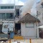 People stand outside the Kool Beach Club after a gas tank explosion in Playa Del Carmen, Mexico, on March 14, 2022.