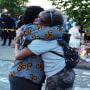 Two women embrace each other during the community vigil for the victims of the shooting in Buffalo, N.Y., on Sunday.